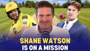 Shane Watson in Chennai Super Kings jersey, in a suit, and speaking into a microphone, with the caption "Shane Watson is on a mission" over a cricket field background.