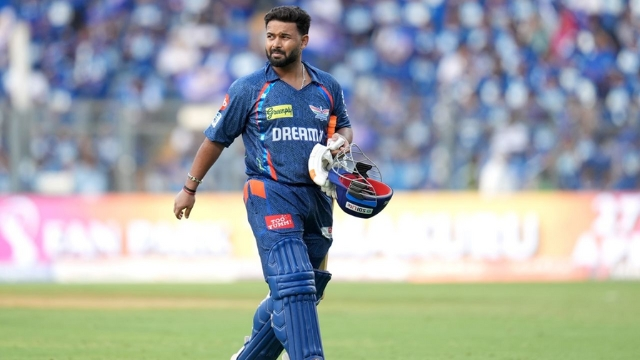 Rishabh Pant, captain of Lucknow Super Giants, walking off the field in full cricket gear during an IPL 2025 match.