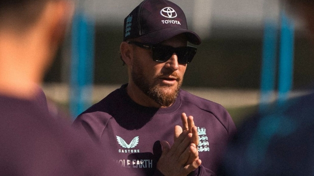 England cricket head coach Brendon McCullum wearing sunglasses and team gear during a 2025 training session.