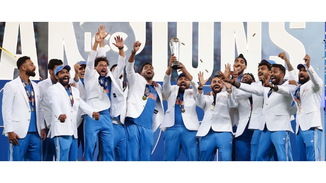 Indian cricket team celebrating victory after winning the ICC Champions Trophy 2025, wearing white blazers and holding the trophy.