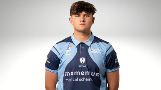 South African cricketer Lhuan-dre Pretorius posing in Momentum jersey after being signed by Rajasthan Royals
