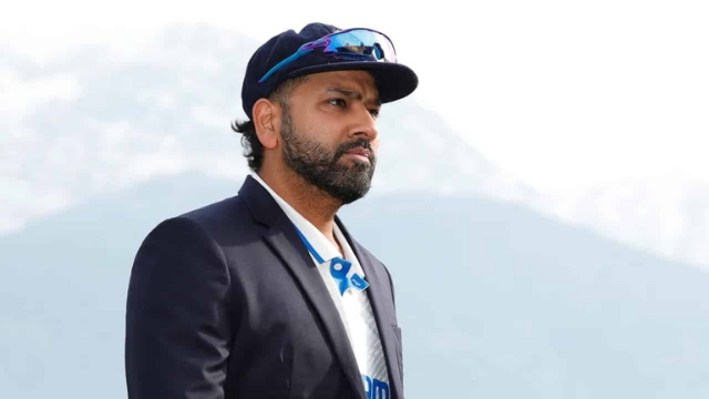 Indian cricketer Rohit Sharma wearing BCCI Test jersey and cap with mountains in the background