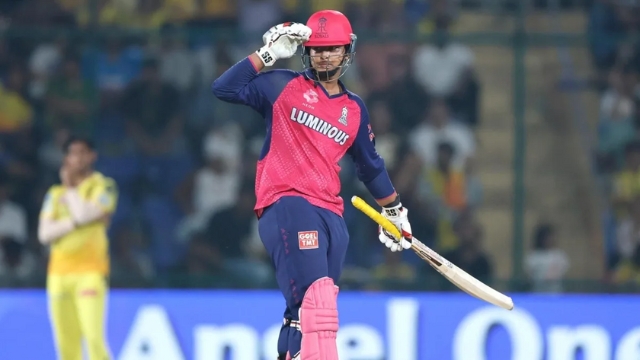 Vaibhav Sooryavanshi celebrating after scoring runs during an IPL 2025 match, wearing Rajasthan Royals jersey and holding a cricket bat.