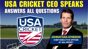 Promotional graphic featuring the headline "USA Cricket CEO Speaks – Answers All Questions" in bold yellow and white text. The image includes the USA Cricket logo and a photo of Johnathan Atkeison, labeled as Chief Executive Officer at USA Cricket, standing in a stadium with empty seats and a cricket field in the background.