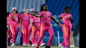 Barbados Royals women's team celebrating during a Women's Caribbean Premier League (WCPL) 2025 match, wearing pink kits and showcasing their teamwork.