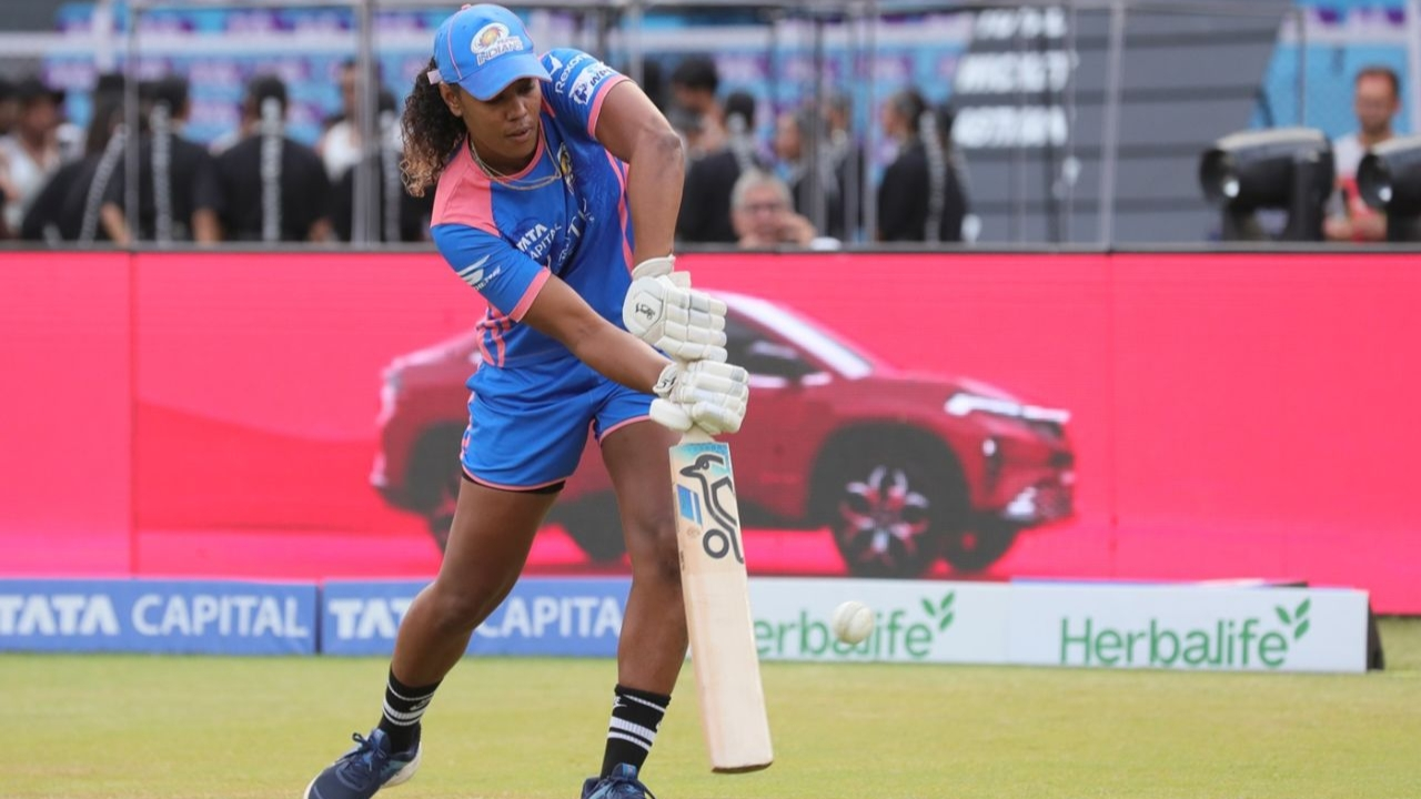 Hayley Matthews of Mumbai Indians batting during a practice session ahead of a Women's Premier League (WPL) match, with sponsor boards for Tata Capital and Herbalife in the background.