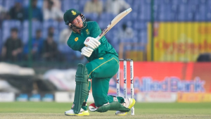 Heinrich Klaasen of South Africa plays a powerful shot during an ODI cricket match, captured mid-action in full green kit.
