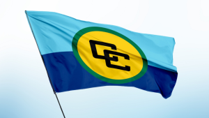 Flag of the Caribbean Community (CARICOM) featuring the official logo with interlocking Cs on a yellow circle over a blue and light blue background.
