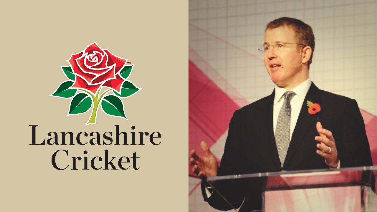 Daniel Gidney speaking at a podium next to the Lancashire Cricket Club logo featuring a red rose on a beige background.