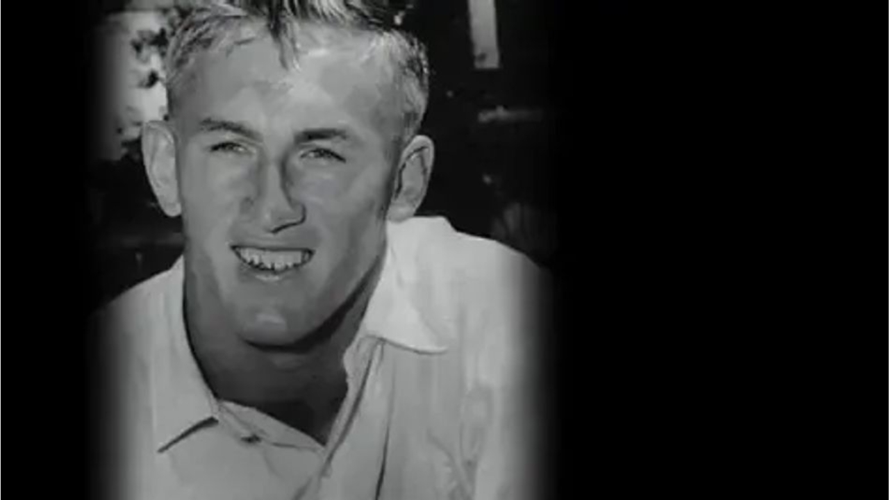 Black and white portrait of Australian cricketer Gordon Rorke in a collared shirt.