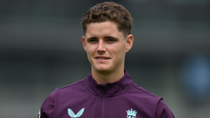 Jacob Bethell in England cricket training kit, smiling during a practice session.