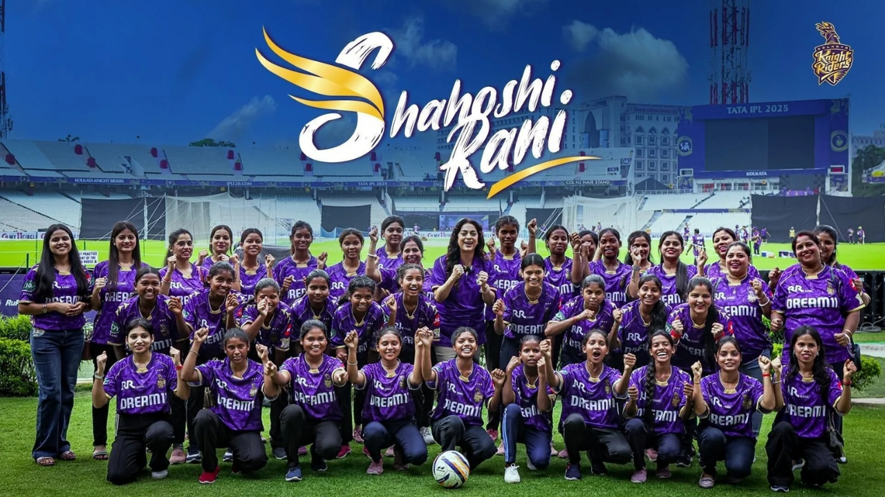 Group photo of young women in purple Kolkata Knight Riders jerseys at Eden Gardens during the launch of the Shahoshi Rani initiative for IPL 2025.