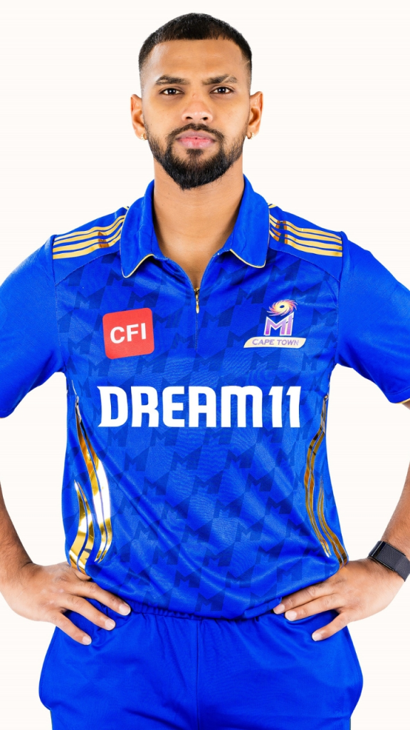 Nicholas Pooran in Mumbai Indians SA20 jersey during a cricket match, focused and ready for action on the field.
