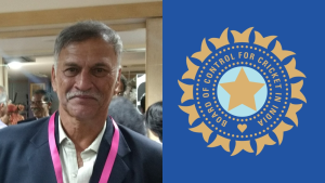 Roger Binny smiling at an event next to the BCCI (Board of Control for Cricket in India) logo on a blue background.
