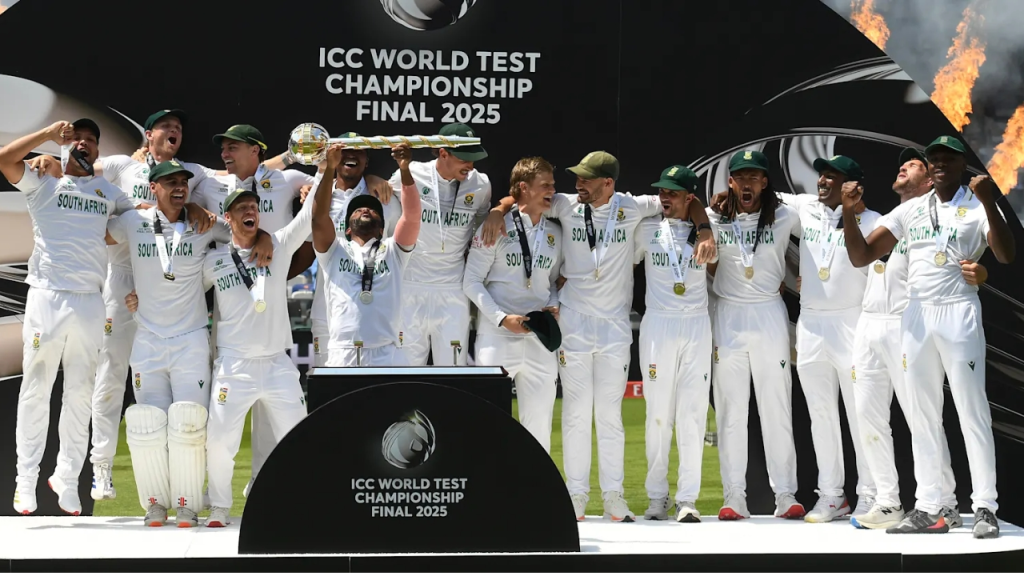 South Africa cricket team celebrates winning the ICC World Test Championship Final 2025 with the trophy on the podium.
