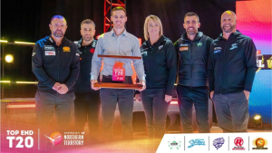 BBL team representatives pose with the Top End T20 trophy during the launch event in Australia's Northern Territory, showcasing team logos and event branding.