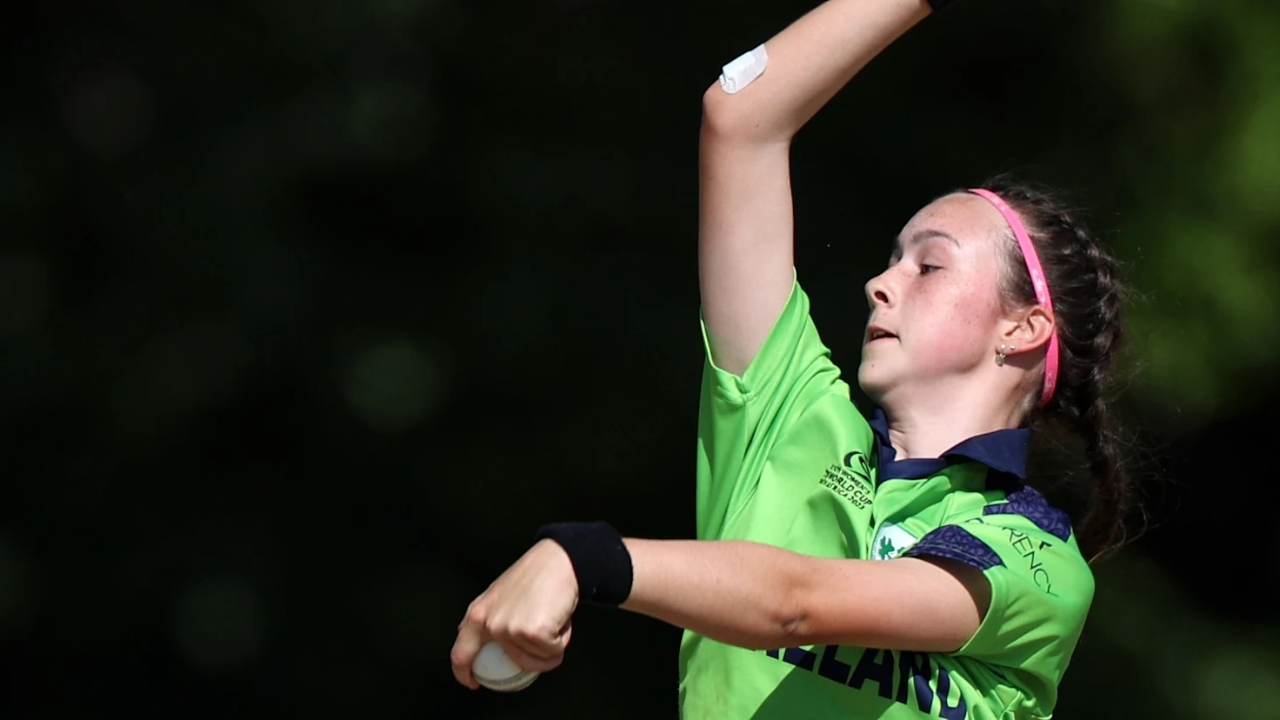 Aimee Maguire in action bowling for Ireland women's cricket team during a match.