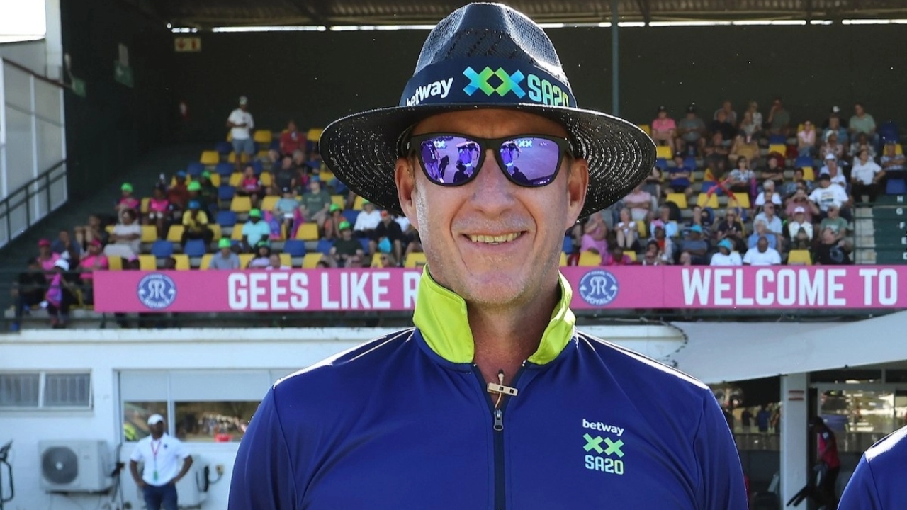 SA20 cricket umpire Arno Jacobs wearing a Betway-branded uniform and hat, standing in front of a crowd at a stadium during the 2025 SA20 league.