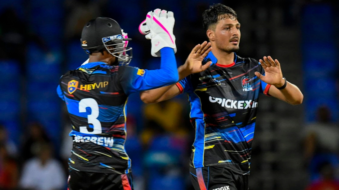 Two cricketers celebrating a wicket during a Caribbean Premier League (CPL) 2025 T20 match, wearing colorful team jerseys.