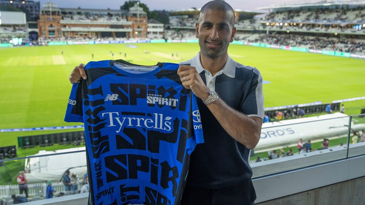 Mo Bobat posing with the London Spirit jersey at a cricket stadium after being appointed Director of Cricket.
