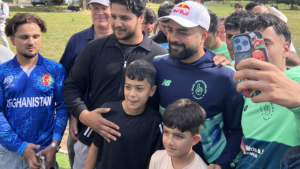 Rashid Khan posing with fans at the launch of upgraded cricket facilities in Kennington Park