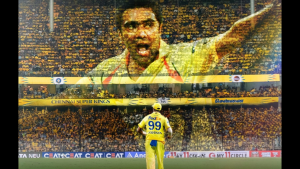 Ravichandran Ashwin in Chennai Super Kings jersey standing before a tribute mosaic of himself created by CSK fans in a packed stadium