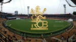 Royal Challengers Bengaluru (RCB) logo overlaid on M. Chinnaswamy Stadium in Bengaluru