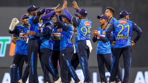 Sri Lanka cricket team players celebrating together on the field during a T20 match.