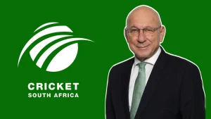 Trevor Manuel, Chair of the Cricket World Cup 2027 Local Organising Committee Board, standing beside the Cricket South Africa (CSA) logo on a green background.