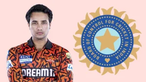 Indian cricketer Abhishek Sharma in Sunrisers Hyderabad jersey with BCCI logo in the background