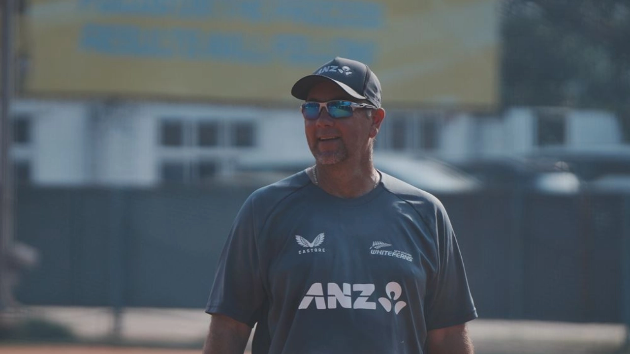 Craig McMillan, head coach of the New Zealand White Ferns, wearing team training gear during a practice session.