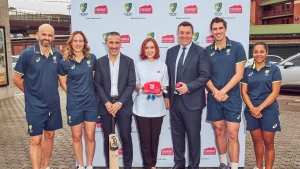 Cricket Australia players and executives pose with Chemist Warehouse representatives during the 2025 partnership launch event, standing in front of a branded backdrop.