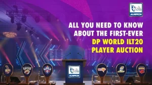 Stage setup for the first-ever DP World ILT20 player auction featuring team logos of ADKR, Desert Vipers, Dubai Capitals, Gulf Giants, MI Emirates, and Sharjah Warriors, with vibrant lights and auction branding in the background.