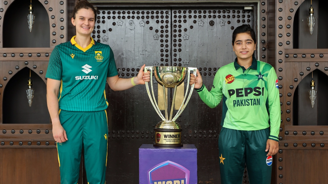 Fatima Sana of Pakistan and Laura Wolvaardt of South Africa pose with the winners trophy ahead of a women's international cricket series in 2025