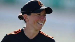 England cricketer Georgia Elwiss smiling during a training session in team cap and kit