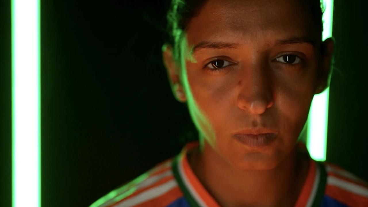 Close-up portrait of Harmanpreet Kaur in India cricket jersey with green lighting effect