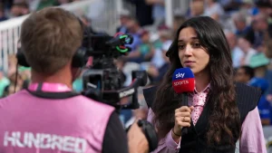 Helen Trappelides, MCC Young Female Broadcaster of the Year, speaking into a Sky Sports microphone during a live cricket broadcast