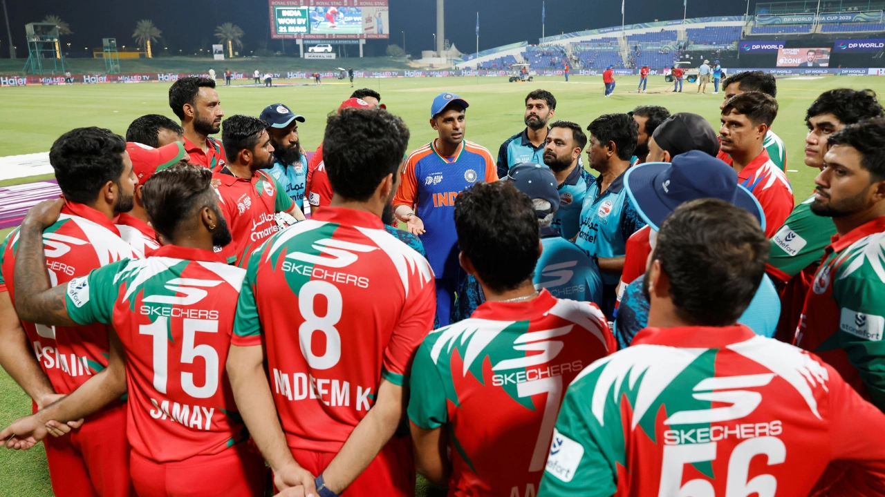 Oman cricket team in a huddle with Indian captain Suryakumar Yadav during Asia Cup 2025 at a stadium under lights