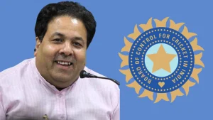 Rajiv Shukla smiling beside the BCCI logo, representing the Board of Control for Cricket in India in 2025