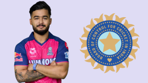 Indian cricketer Riyan Parag wearing Rajasthan Royals jersey standing with arms crossed next to the Board of Control for Cricket in India (BCCI) logo on a light purple background.