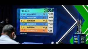 Top player sales board at the SA20 2025 auction showing Dewald Brevis as the highest bid at R16.5 million, alongside the tournament trophy and Betway branding.