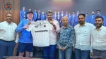 Shaun Williams with officials from the Maharashtra Cricket Association unveiling the team jersey during a formal event.