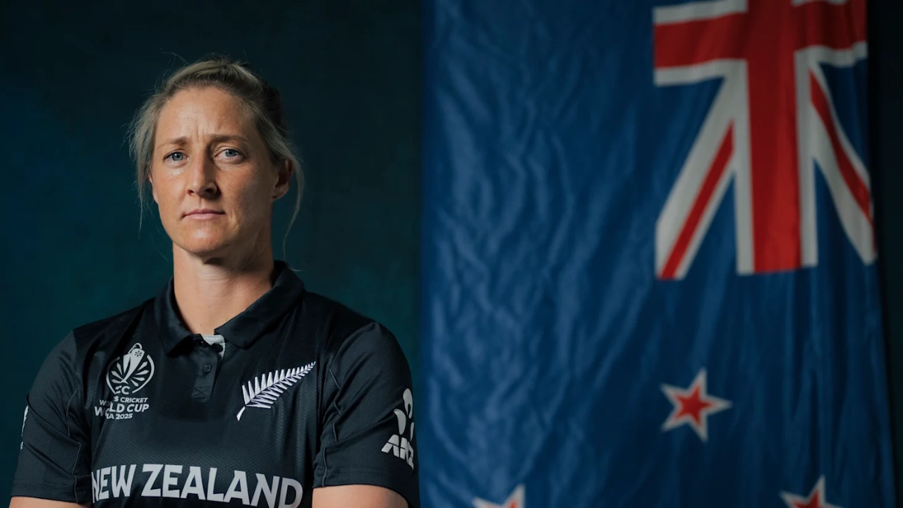 Sophie Devine in New Zealand cricket jersey standing confidently with the New Zealand flag in the background
