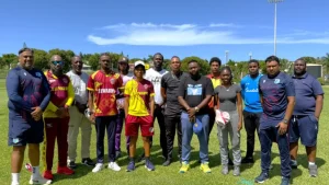 Brendon Ramlal and Keshava Ramphal with young cricket participants at Coolidge Cricket Ground in Antigua
