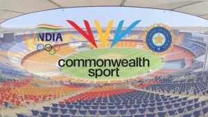 BCCI, Indian Olympic Association, and Commonwealth Sport logos overlaid on Narendra Modi Stadium in Ahmedabad, India.