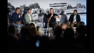 Ben Stokes, Kane Williamson, and Eoin Morgan speaking at a cricket panel discussion in front of a live audience
