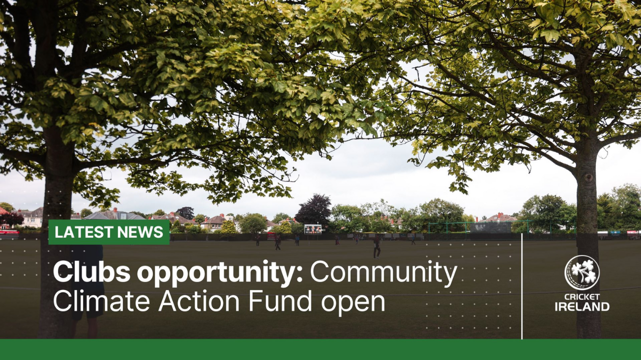 Cricket field with trees and players in the background promoting Cricket Ireland's Community Climate Action Fund opportunity.