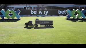 Miniature DP World truck on a cricket field with Betway branding in the background during an SA20 League match.