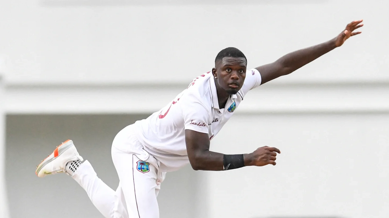 Jayden Seales in West Indies Test jersey delivering a ball during a match