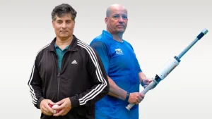 Julian Wood and Dr. Rene Ferdinands, cricket coaching experts, posing with training equipment